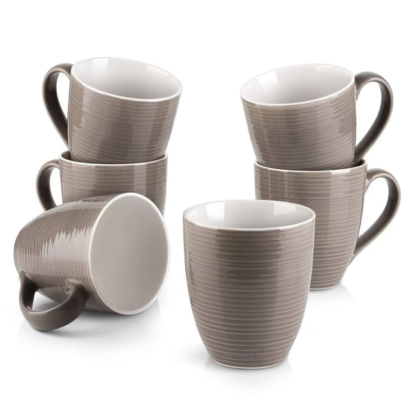 Set of six gray coffee mugs with ribbed texture on a white background