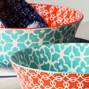 Set of colorful patterned bowls on a white background