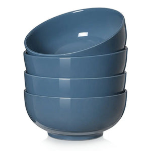 Stack of blue ceramic bowls on a white background