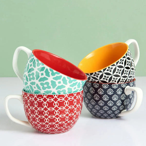 Four mugs of the same style in different colors, stacked.