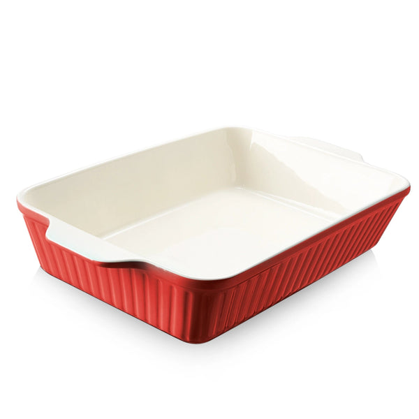 Rectangular ceramic baking dish with red exterior and beige interior on a white background