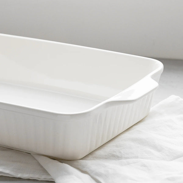 White ceramic baking dish on a light gray background